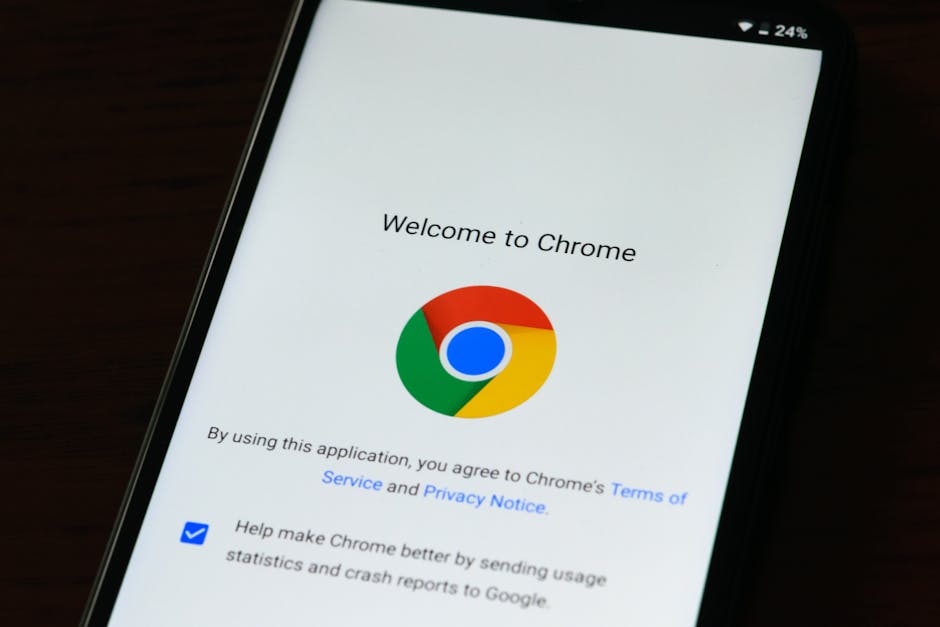 Close-up of smartphone displaying Google Chrome's welcome page and logo.